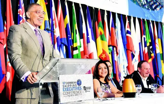  ??  ?? Prime Minister Andrew Holness addresses delegates at the Caribbean Shipping Associatio­n’s 18th Caribbean Shipping Executives Conference at The Jamaica Pegasus hotel, yesterday.