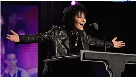  ??  ?? Top: with Green Day’s Billie Joe Armstrong in 2014. Above: Jett delivers her missive at her Rock And Roll Hall Of Fame induction, 2015.