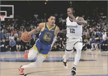  ?? AP PHOTO/BRANDON DILL ?? Golden State Warriors guard Jordan Poole (3) drives against Memphis Grizzlies guard Ja Morant (12) in the second half during Game 1 of a second-round NBA basketball playoff series on Sunday in Memphis, Tenn.