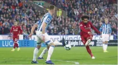  ?? — Reuters ?? Liverpool’s Mohamed Salah shoots at goal.