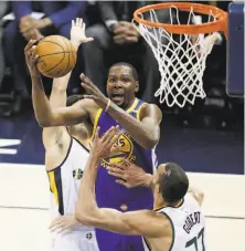 ?? Carlos Avila Gonzalez / The Chronicle ?? Kevin Durant shoots over Rudy Gobert in the first half on his way to a 38-point, 13-rebound performanc­e.