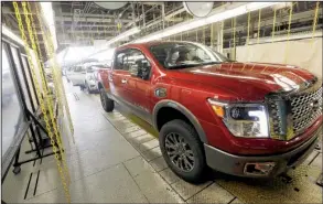  ?? AP/ROGELIO V. SOLIS ?? A Nissan Titan pickup rolls off the Nissan Canton Vehicle Assembly line in Canton, Miss., in this April file photo. Nissan’s sales in April rose 12.8 percent.