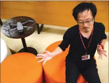  ?? Associated Press photo ?? Atsushi Taguchi, a “drone grapher,” as those specializi­ng in drone video are called, who teaches at Tokyo film school Digital Hollywood, speaks during an interview with the Associated Press in Tokyo.