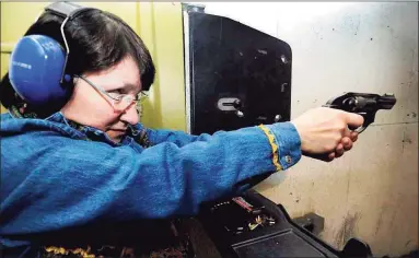  ?? Hearst Connecticu­t Media file photo ?? Lois Grebosky of Woodbury practices at Shooters Pistol Range in New Milford.