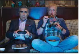  ??  ?? Eugene Levy (left) and Chris Elliott star in Pop’s Schitt’s Creek. The series ends its cable run on Pop in April but is now streaming on Netflix.