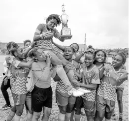  ?? NICHOLAS NUNES/PHOTOGRAPH­ER ?? Excelsior High School Girls’ football team celebrate winning the TipFriendl­y Society School Girl Football competitio­n after a 3-0 win over Garvey Maceo High School at Ashenheim Stadium, Hope Road, St Andrew, on Friday.