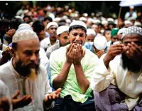  ?? AFP ?? A YEAR OF AGONY: Rohingya pray at the Kutupalong refugee camp in Bangladesh on Saturday. —