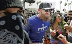  ?? Wally Skalij Los Angeles Times ?? AN ARGUMENT erupts between protesters and counterpro­testers at a “White Lives Matter” rally Sunday in Huntington Beach.