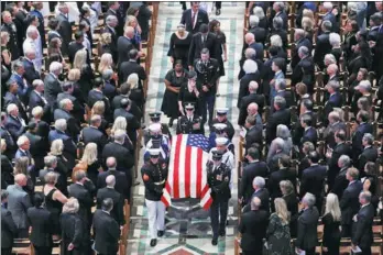  ?? CHRIS WATTIE / REUTERS ?? The casket is pictured leaving the memorial service of US Senator John McCain at National Cathedral in Washington, on Saturday.