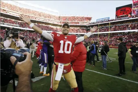  ?? BEN MARGOT — THE ASSOCIATED PRESS ?? San Francisco quarterbac­k Jimmy Garoppolo celebrates after the 49ers beat the Vikings in an NFC divisional playoff game, Saturday in Santa Clara, Calif.