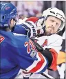  ?? AP PHOTO ?? New York Rangers’ Chris Kreider (20) and Ottawa Senators’ Dion Phaneuf (2) fight during the second period of Game 4 of an NHL hockey Stanley Cup second-round playoff series Thursday in New York.