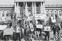  ?? New York Times file photo ?? People protesting presidenti­al election results attend a “Stop the Steal” rally at the Pennsylvan­ia Capitol in Harrisburg.