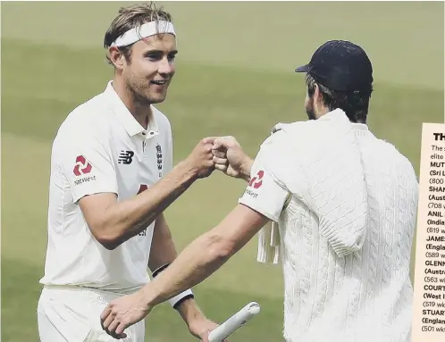  ??  ?? 2 England’s star bowlers Stuart Broad and Chris Woakes, right, celebrate after clinching victory over the West Indies at
Old Trafford.