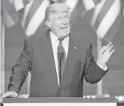  ?? Alex Wong / Getty Images ?? Republican presidenti­al candidate Donald Trump accepts his party’s nomination Thursday at the Republican National Convention in Cleveland.