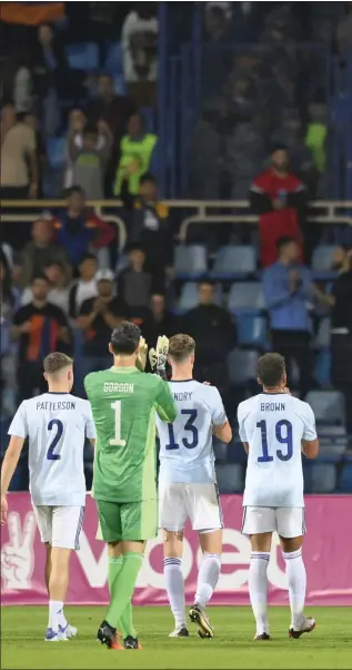  ?? ?? The Scotland players applaud the travelling away supporters after the full-time whistle in Yerevan