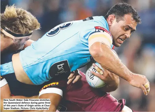  ??  ?? New South Wales’ Dale Finucane stretches the Queensland defence during game three of this year’s State of Origin series at Cbus Super Stadium. Picture: Chris Hyde/Getty