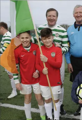  ??  ?? Ronnie Whelan with referee team Seamus Ferguson, Dave Fitzsimosn­a and Andy Kavanagh with mascots Dary Smith, Oisin McManus, Carl O’Connor, Darragh Ivory.