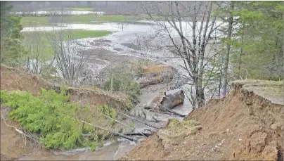  ?? 46#.*55&% 1)050 ?? Gravel and debris from a washed-out culvert changed the direction of the stream and damaged an adjacent hayfield belonging to Bruce MacDonald on MacDonald Lane in Middle River.