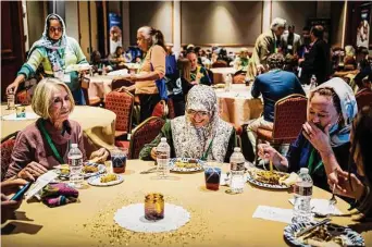  ?? Meridith Kohut/Contributo­r ?? Shameem Nainar, center, attends a “Meet Your Muslim Neighbors” event on Saturday in Houston with her friend Denise Wilson, right, and her mother, Barbara, left.