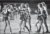  ?? Steve Galluzzo For The Times ?? RECEIVER Kate Kubiak receives congratula­tions after scoring a touchdown for Newport Harbor.