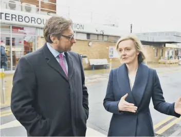  ??  ?? James Palmer with then Justice Secretary Liz Truss; right at Newark Road where affordable homes are to be built and (far right) on election night.