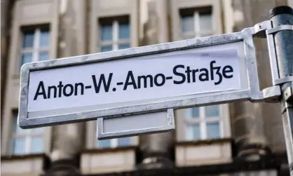  ?? Photograph: Jan Scheunert/Zuma Wire/Rex/Shuttersto­ck ?? A sticker reading Anton-W-Amo-Straße covers a Mohrenstra­ße sign in Berlin.