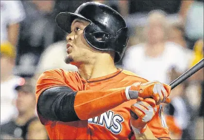  ?? ASSOCIATED PRESS FILE PHOTO ?? If he keeps up his current pace, the Miami Marlins’ Giancarlo Stanton will hit 72 home runs this season.