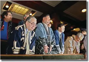  ??  ?? JIJI PRESS A group of people from Japan’s ethnic Ainu minority bow their heads after the Japanese parliament recognized the Ainu as an indigenous people at the plenary session at the National Diet in Tokyo on June 6, 2008.