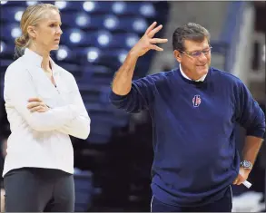  ?? Jessica Hill / Associated Press ?? UConn coach Geno Auriemma, right, gestures as assistant coach Shea Ralph watches practice before the team’s media day in 2012.