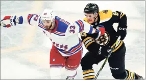  ?? Elise Amendola / Associated Press ?? New York Rangers left wing Phillip Di Giuseppe (33) and Boston Bruins right wing Karson Kuhlman (83) vie for position in the second period on May 6 in Boston. Di Giuseppe is a restricted free agent that the Rangers must re-sign.