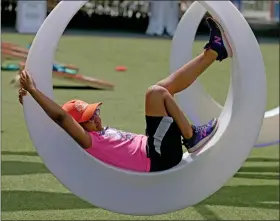  ?? MATT STONE/ BOSTON HERALD ?? Jamie Greene, 9 of Boston, swings on a swing at The Lawn On D Thursday in Boston.