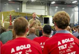  ?? PHOTO COURTESY OF THE BOEING COMPANY ?? Among a sea of Boeing employees wearing red T-shirts identifyin­g the “bold tilt to a bright future” in V-22 Osprey production, U.S. Marine Corps Deputy Commandant for Aviation Lt. Gen. Steven Rudder spoke to a crowd about the importance of aircrafts like the Osprey to the defense of the country.