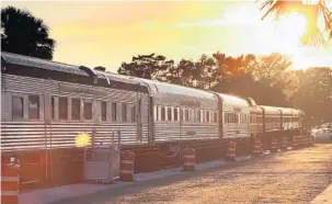  ?? STEPHEN M. DOWELL/STAFF PHOTOGRAPH­ER ?? The Polar Express Train gleams in the setting sun at the train station Saturday in downtown Tavares. It’s one of 42 Polar Express trains in the U.S. offering a theatrical journey, licensed by Warner Bros.