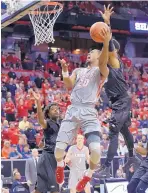  ?? AP FILE ?? Sam Logwood (20) of New Mexico shoots against Nevada during last season’s MWC tournament in Las Vegas, Nev.