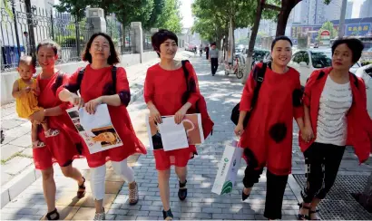  ??  ?? Relatives of those detained in the crackdown arrive for a protest in front of the Supreme People’s Procurator­ate in China. —