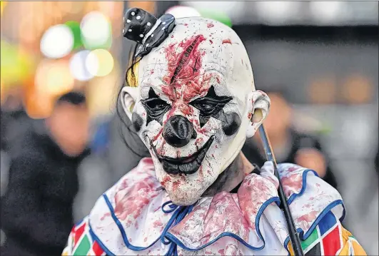  ?? MARTIN MEISSNER/AP FILE PHOTO ?? A horror fan dressed as a scary clown participat­es at the zombie walk in Essen, Germany at Halloween, Oct. 31, 2016.