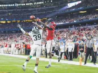  ?? LM Otero, The Associated Press ?? Alabama wide receiver Calvin Ridleymake­s a touchdown catch against Michigan State cornerback Jermaine Edmondson during the second half of the Cotton Bowl in Arlington, Texas, on Thursday night. The game was the second national semifinal in the College...