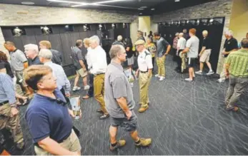  ?? Cliff Grassmick, Daily Camera file ?? Donation-paying members of the Buff Club tour Colorado’s new facilities at Folsom Field — including the football team’s locker room — in August 2015.