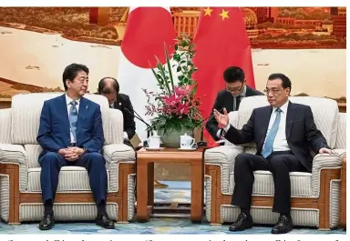  ??  ?? Promising meeting: Abe (left) and Li in discussion at the Great Hall of the People in Beijing. — Reuters