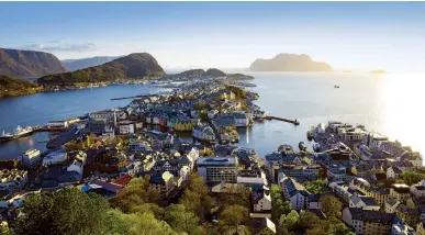  ??  ?? Fabulous Fjordland: Enjoy intriguing Alesund, above, the view from Pulpit Rock, Stavanger, above right, and the city of Bergen, right