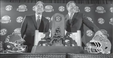  ?? AP/BUTCH DILL ?? Alabama Coach Nick Saban (left) and Florida Coach Jim McElwain have their respective teams in today’s SEC Championsh­ip Game for the ninth time in the 25-year history of the game. The top-ranked Crimson Tide have won 24 games in a row and beat the No....