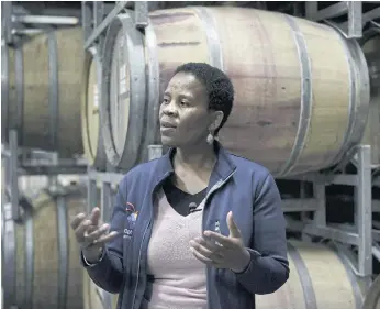  ??  ?? RAISING GLASS: Winemaker and owner of Aslina Wines, Ntsiki Biyela gestures as she talks about her process at the Koelenhof Winery where she produces her wine ‘Aslina’ in Stellenbos­ch, South Africa.