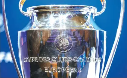  ??  ?? The UEFA Champions League trophy is displayed, during the drawing of the matches for the Champions League 2019/20 Play-offs round