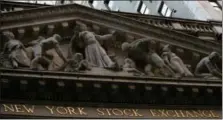  ?? MARY ALTAFFER — THE ASSOCIATED PRESS FILE ?? This file photo shows the New York Stock Exchange at sunset in lower Manhattan.