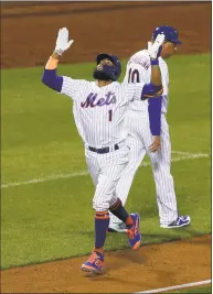  ?? Jim McIsaac / Getty Images ?? The Mets’ Amed Rosario reacts as he runs the bases after his fourth-inning three-run homer against the Giants on Wednesday.