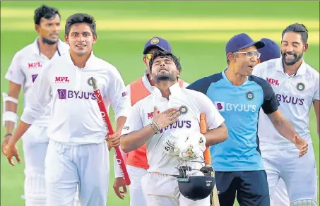  ?? PTI ?? Indian players celebrate after defeating Australia by three wickets on the final day of the fourth Test match at the Gabba in Brisbane on Tuesday.