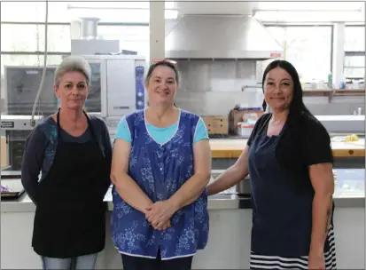  ?? PHOTOS BY JACLYN LUNA ?? Julie Vassar, Tina Cresswell and Jodi Phillips serve meals through the Seamless Summer Program and also to WUSD schools that are in session for summer school.