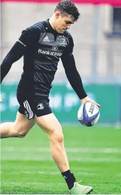  ?? RAMSEY CARDY/ SPORTSFILE ?? Rory O’Loughlin is tackled by Munster’s Dan Goggin in their interprovi­ncial clash; Garry Ringrose hard at work in Energia Park