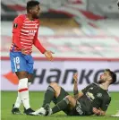  ??  ?? Bruno Fernandes (right) gestures to Yan Brice after the Granada player fouled the Portuguese in the penalty box. Photograph: Matthew Peters/Manchester United/Getty Images