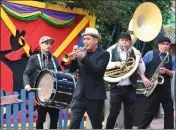  ?? CHRIS RILEY — TIMES-HERALD ?? Members of the Honor Brass Band play music if New Orleans flair as they walk around Six Flags Discovery Kingdom to kickoff the Mardi Gras festival on Saturday in Vallejo.